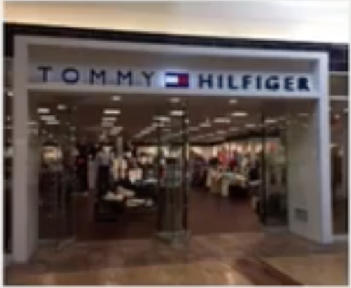 Image 36: The storefront of a Tommy Hilfiger store in a mall setting